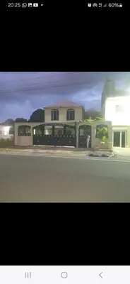 a picture of a house on the side of a street at las taranas villa tropical