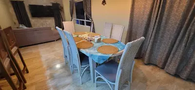 a dining room table with chairs and a blue table cloth at Luxury Cabarete East Condominiums in Cabarete