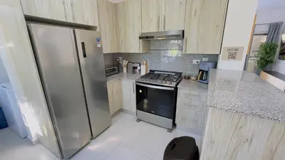 a kitchen with a stainless steel refrigerator and a stove at Apartamento Armonía-K-204 in Las Terrenas