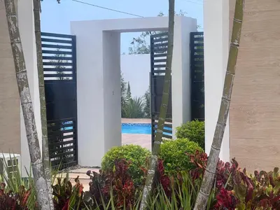 a view from the outside of a house with a pool at jardines de caleta 7 in La Romana
