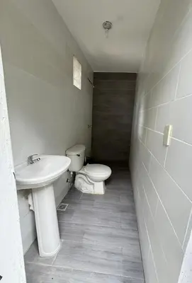 a bathroom with a toilet and a sink at Charming villa in San Pedro de Macorís