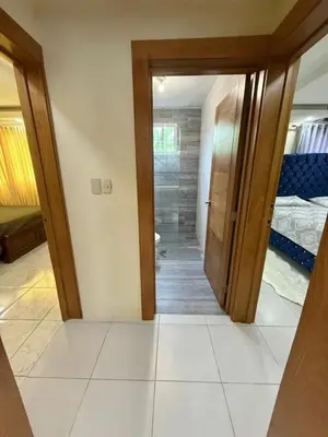 a hallway with a door leading to a bedroom at Charming villa in San Pedro de Macorís