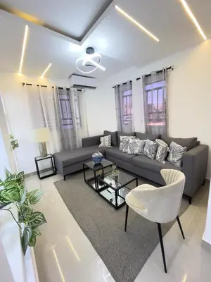 a living room with a couch and a table at Encanto - La Romana near Caleta beach in La Romana