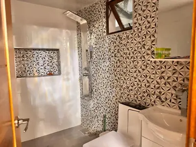a bathroom with a shower and a white toilet at Exclusive Huge and Lovely 4 bedrooms and 3 bathrooms apartments in Santiago close to all funs in Santiago de los Caballeros