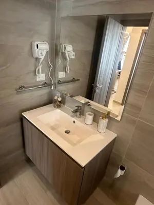 a bathroom with a sink and a mirror at Escape perfecto, punta cana in Punta Cana