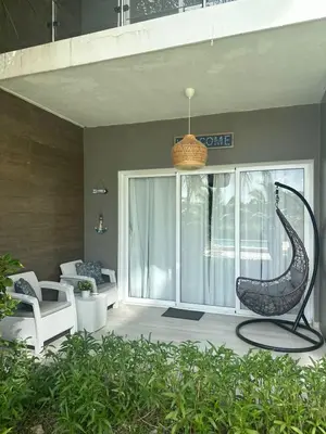 a metal sculpture of a snake sitting on a patio at Escape perfecto, punta cana in Punta Cana