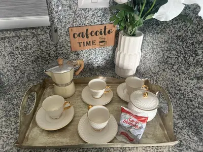 a tray with cups and saucers on a table at Escape perfecto, punta cana in Punta Cana