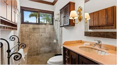 a bathroom with a sink and a toilet and a shower at Chic Villa Pool Casa de Campo in La Romana