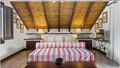 a living room with a couch and a table at Chic Villa Pool Casa de Campo in La Romana