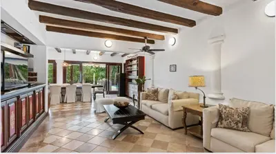 a living room with couches and a table at Chic Villa Pool Casa de Campo in La Romana