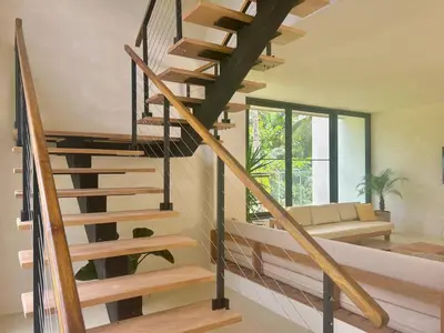 a spiral staircase in a house with a living room at Luxury Family Villa With Pool Near Playa Bonita in Las Terrenas