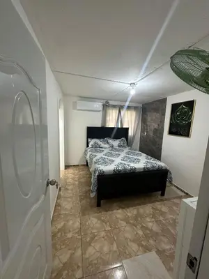 a bedroom with a bed in a room at Residencial JG in Punta Cana