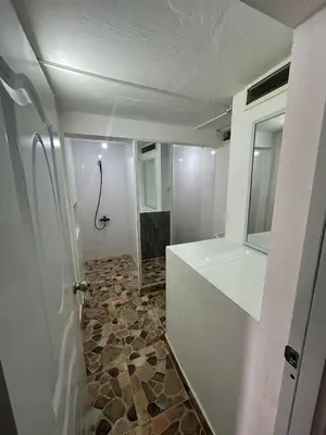 a bathroom with a shower and a toilet and a sink at Residencial JG in Punta Cana