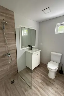 a bathroom with a toilet and a glass shower stall at La belle planque de Punta Cana- Playa 10 minutos a pie in Punta Cana