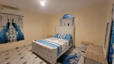 a bedroom with a bed and a dresser in it at Descansa sin prisas a minutos del Aeropuerto in La Caleta