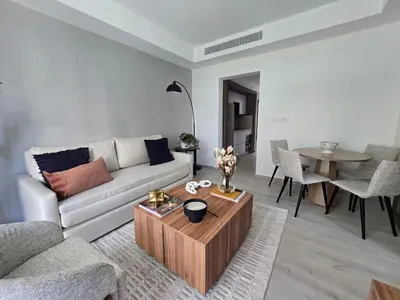 a living room with a couch and a table at Apartamento a estrenar con acceso privado a la playa in Punta Cana
