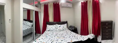 a bedroom with a bunk bed and a mirror at Lujoso apartamento cerca del aeropuerto SDQ in La Caleta