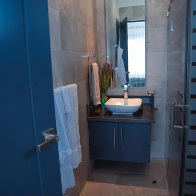 a bathroom with a sink and a mirror at Caribbean getaway Villa 30 in Puerto Plata