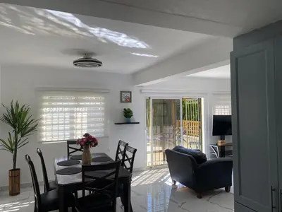 a living room with a table and chairs at Luxury Villa in Muñoz, Puerto Plata in Puerto Plata