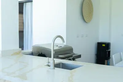 a kitchen with a sink and a sewing machine at Newly Built Luxury Private 3 Bedroom Pool Villa in Sosúa