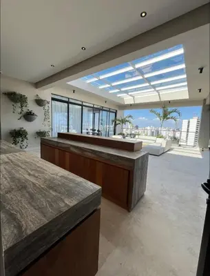 a lobby with a bar with a view of the city at Luxury 2-Bed Condo in Piantini Sauna, Gym, and Pool in Santo Domingo