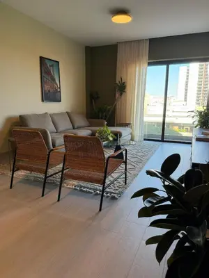 a living room with a couch and two chairs at Luxury 2-Bed Condo in Piantini Sauna, Gym, and Pool in Santo Domingo