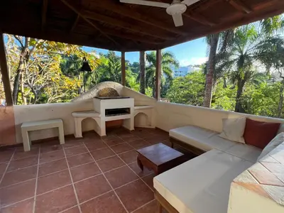 a living room with a couch and a table at Rose&mary in Las Terrenas