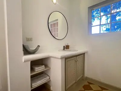 a bathroom with a sink and a mirror at Rose&mary in Las Terrenas