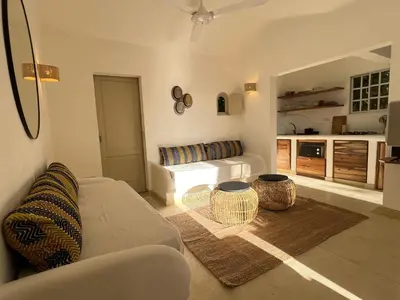a living room with a couch and a table at Rose&mary in Las Terrenas