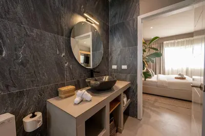 a bathroom with a sink and a mirror at New* 3BR Loft | Pool | Patio | 2 mins to Beach in Las Terrenas