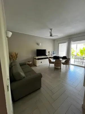 a living room with a couch and a table at Luxury apartment Tracadero 2 Bedrooms Sea Pools access Private Garden Workspace in La Laguna