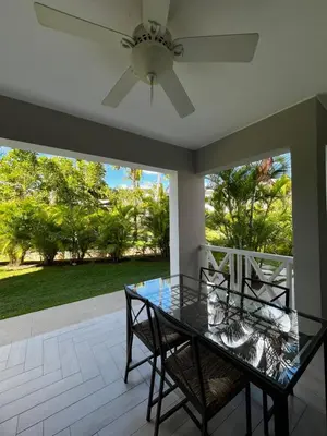 a dining room with a glass table and chairs at Luxury apartment Tracadero 2 Bedrooms Sea Pools access Private Garden Workspace in La Laguna