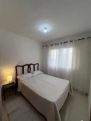 a bedroom with a bed and a window at Comfortable apartment near the airport in La Javilla