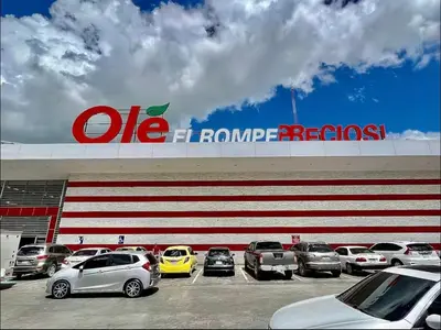 a group of cars parked in front of a store at Comfortable apartment near the airport in La Javilla