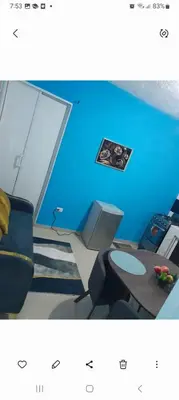 a picture of a blue room with a desk and a computer at Apartamentos La Mina in Manuel Chiquito