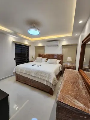 a bedroom with a large bed in a room at Villa M & M in Guerra