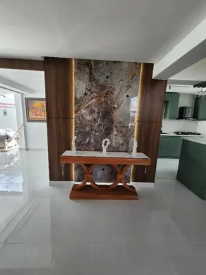 a table in a room with a stone wall at Villa M & M in Guerra