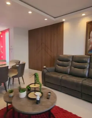 a living room with a couch and a table at Villa M & M in Guerra