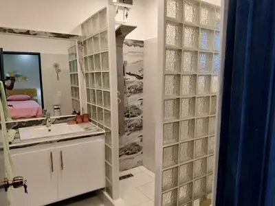 a bathroom with a sink and a mirror at Nice rooftop apartment in La Cabirma