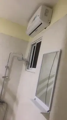 a hospital room with a light and a mirror at Hotel 3 Hnos in Comendador