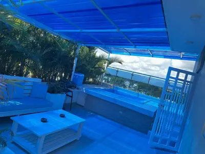 a balcony with a view of a swimming pool at Dominique ugolin in Mata Chalupe