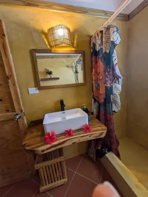 a bathroom with a sink and a mirror at Casa los Mangos Private pool 150 m from the beach in Las Galeras