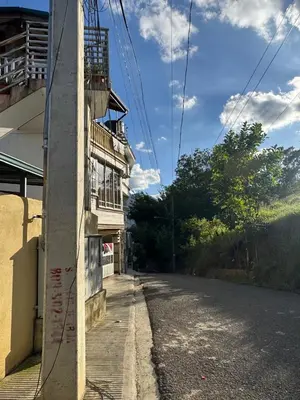 an empty street with a building on the side at Cielo Alto in Jarabacoa