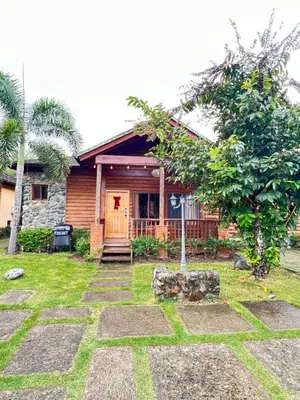 a house with a stone pathway in front of it at Estaciones de Jarabacoa-Mountain Lodge in Jarabacoa
