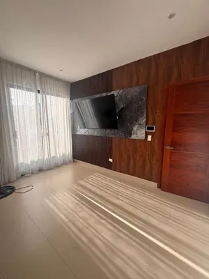 a living room with a flat screen tv on a wall at Luxury Caribbean Oasis, Private Pool & BBQ, 8 Guest in La Romana