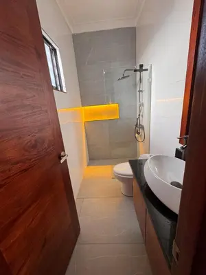 a bathroom with a sink and a toilet at Luxury Caribbean Oasis, Private Pool & BBQ, 8 Guest in La Romana