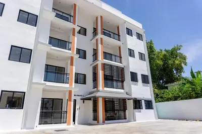 an exterior view of a white building at Apartamento Ensanche Isabelita cercano Avenida España in La Viva