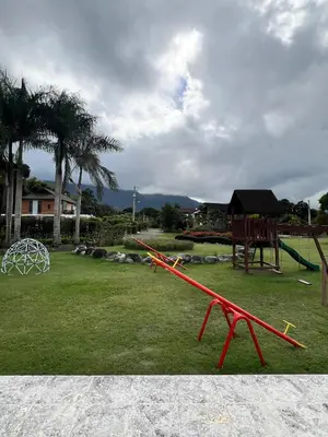 a park with a playground with a swing set at Estaciones de Jarabacoa - Mountain Lodge in Jarabacoa