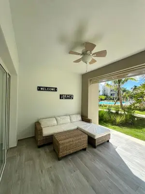 a living room with a couch and a ceiling fan at 1BR Tracadero Lodge, beach access & full amenities in La Laguna