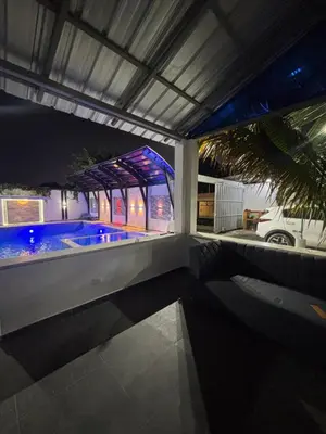 a house with a swimming pool at night at Villa la pal de 4 in La Ureña